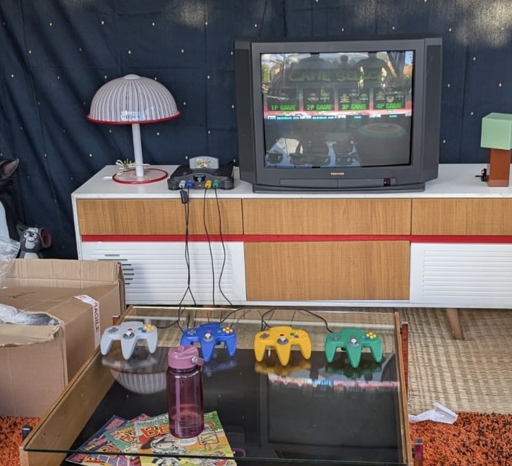 N64 game console with period correct CRT television. Ideal for retro gaming events.